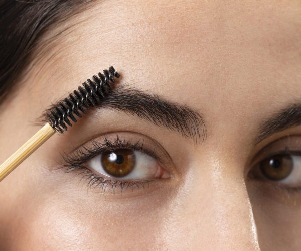 woman-taking-care-her-eyebrows